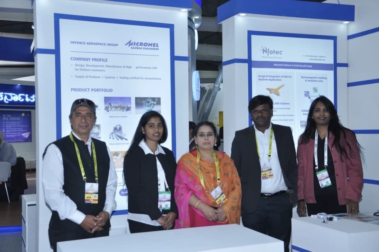 The MICRONEL Global Engineers and NFOTEC teams at an exhibition stand
